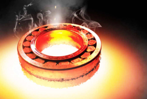 A roller bearing with severe overheating, overheating can pose potential damage if not handled promptly