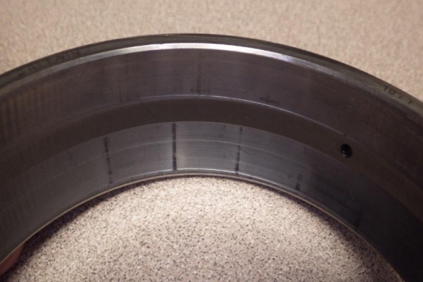 image shows the outer ring of a spherical roller bearing showing the effects of false brinelling.